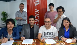Contract Signing.  From left to right:  Koichi Saito, Director, IMJ Investment Partners (JAPAN); Farouk Meralli, CEO & Founder, mClinica; Dave McClure, Founding Partner, 500 Startups; and Minette Navarrete, President, Kickstart Ventures. Behind them   are (L-R) Christian Besler, Vice-President, Kickstart; Kaspar Zhou, Principal, 500 Startups; and Khailee Ng, Managing Partner, 500 Startups.