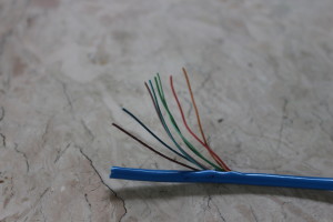 Figure 2.  Fake cable sold as Cat5e.  The wires are not twisted pairs and also are easy to break.  The cover of the cable is easy to tear apart.