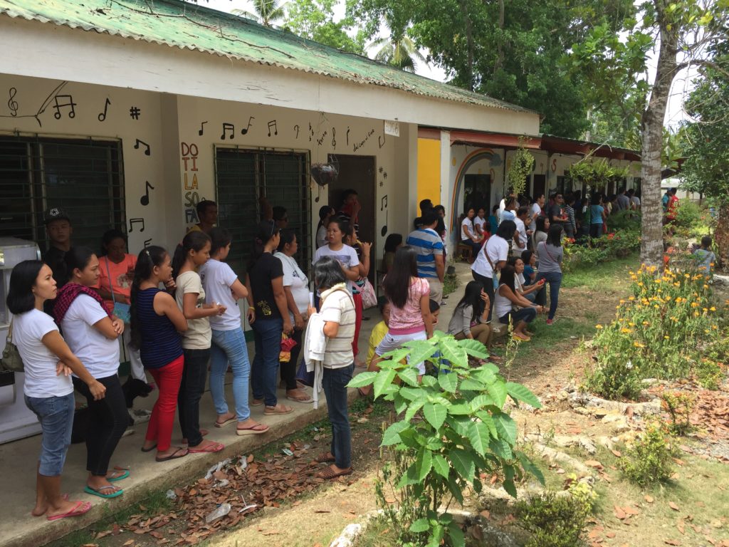 Voters line up at San Isidro Elementary school, Tagbilaran City